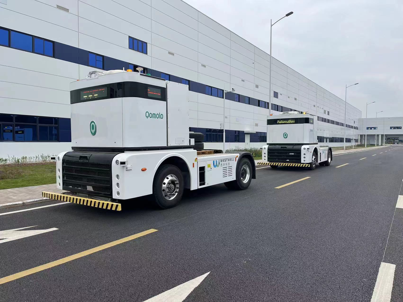 Westwell Q-Truck autonomous logistics vehicle carrying materials through the SERES factory, enabling smart manufacturing and unmanned transport operations.